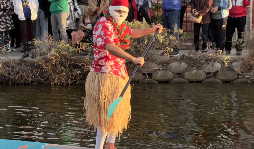 Santa on a paddle board Venice Canal Boat Parade Christmas Decorations Holiday Decorations California Celebration