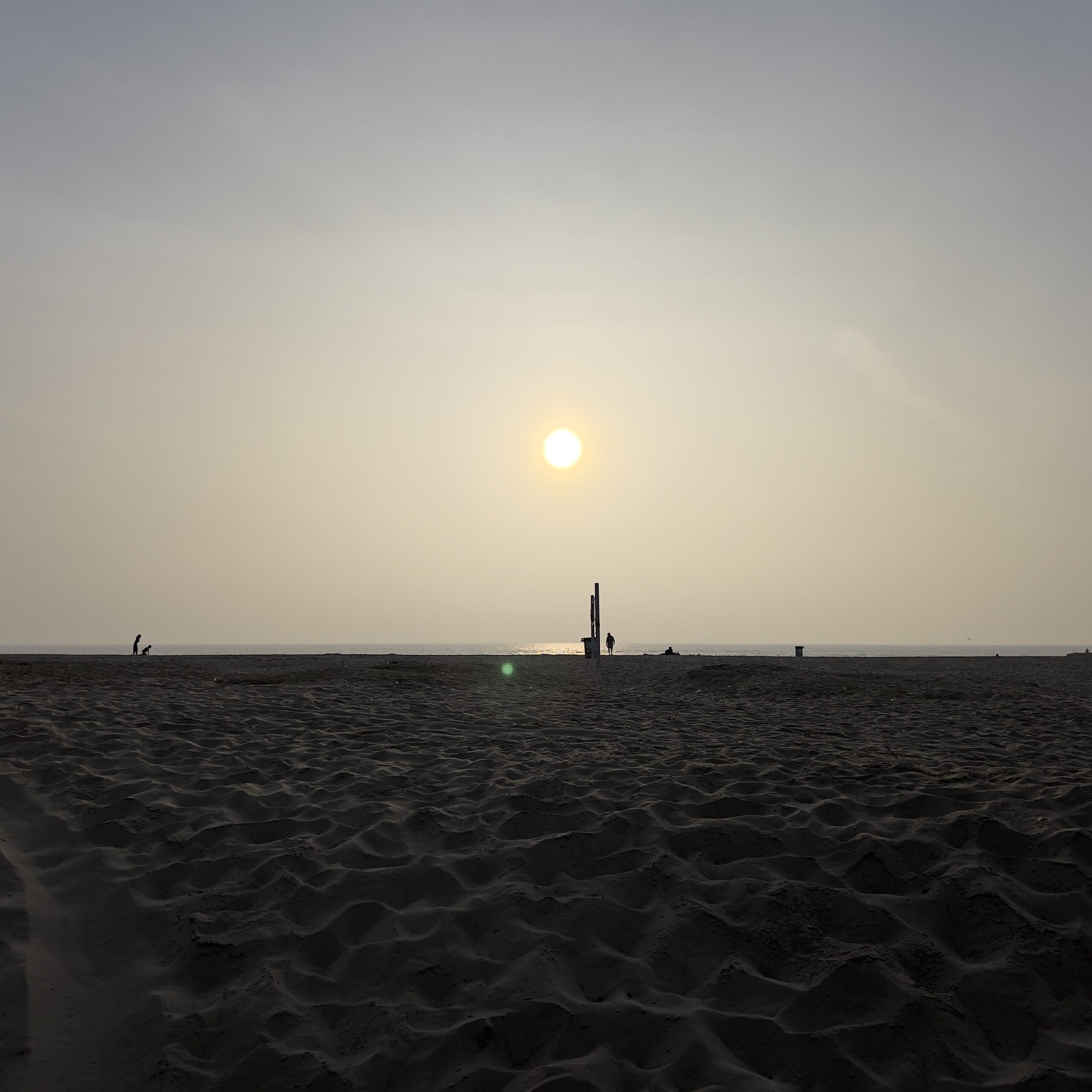 sun setting over sand and the ocean Those Someday Goals